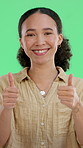 Face, happy woman and thumbs up on green screen for success, yes or agreement in studio. Portrait, smile and model with like hand gesture for feedback sign, recommendation or thank you on background