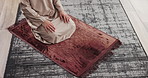 Prayer, man and hands in home for muslim religion, worship and praise to God with mindfulness and gratitude. Above, faith and person bow in islam for peace, mat and culture while praying in house