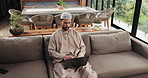 Muslim man, research or typing in home with laptop for Sharia banking, finance plan or investment. Islamic person, thinking or browse with computer for religious insurance, financial website or info.