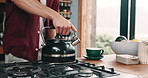 Hands, kettle and person in kitchen with coffee, breakfast and cup on counter in apartment. Boiling, steam and man pouring hot water on gas stove for morning drink, relax and tea process in home