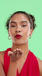 Date, blowing kiss and face of woman on green screen for confidence, happy attitude and flirt. Care, emoji and portrait of girl on studio background for romance, affection and smile with hand gesture