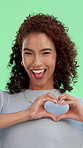 Smile, heart hand and face of woman on green screen with positivity, comfort or gratitude. Happy, portrait and female person with love emoji for support, care or kindness on studio background
