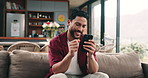 Fist pump, couch and happy man with phone for entertainment, playing online video game and winning. Smile, match success or person with mobile app for digital battle, competition and victory weekend.