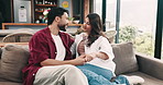Couple, smile and relax on sofa in home with security, support and relationship connection. Love, people and happy in living room with conversation, marriage commitment and bonding together with care