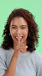 Face, quiet and woman on green screen for secret, privacy and confidential joke in studio. Portrait, silence and happy model with finger on lips for shush sign, funny gesture or whisper on background