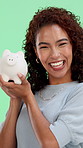 Happy woman, face and smile with piggy bank on green screen for investment, budget or finance. Portrait, excited female person and money savings for coin, profit or investing on studio background