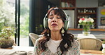 Yoga, woman or breathing with headphones on sofa for guided meditation, mindfulness or calm audio. Yogi, person or relax with zen playlist in home for anapanasati, stress relief or spiritual wellness