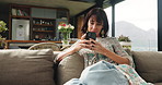 Woman, relax and phone on couch at house for social media, surfing internet and reading ebook. Thinking, mature person and mobile with online chat, browsing website and message notification in lounge