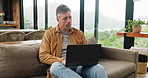 Thinking, home and man with laptop for remote work, article inspiration or problem solving. Computer, freelancer and mature journalist with idea for story, planning headline and  news research