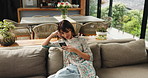 Above, woman and phone on couch at house for social media, surfing internet and reading ebook. Mature person, relax and mobile app for online chat, browsing website and message notification in lounge
