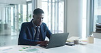 Office, employee and man with laptop, typing and financial analysis on website, graphs and paperwork. Online, data analyst and black person with tech for asset management, documents and budget review
