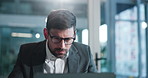 Laptop, glasses and businessman in office with reading for finance report with company budget. Computer, research and financial manager working on investment proposal with stock market in workplace.