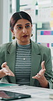 Conversation, meeting and presentation with business woman in boardroom for pitch or proposal. Explain, ideas and vision with Indian employee at table in office for project planning or strategy