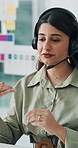 Customer service, list and woman with headset in office, help desk and talking for troubleshooting. Communication, tech support and virtual assistant consulting with client, online advice and hotline