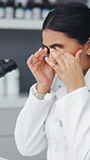 Eye strain, microscope and science with woman in laboratory for medical development or research. Burnout, pharmaceuticals and vision fatigue with scientist at work on clinical trial or experiment