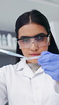 Woman, scientist and pipette with sample in lab for research, medical study and testing dna. Below, female person and blood for genetic experiment, biotechnology and specimen for vaccine development