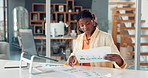Business, documents and black woman in office, computer and charts for profit growth. African person, investor and employee in workplace, reading and graphs for company revenue, report and internet