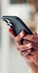 Hands, phone and typing with business person in office for search, social media or text message. App, communication and mobile with employee woman in professional workplace for post or update