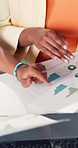 Documents, hands and business women in office with planning for finance report with statistics. Discussion, collaboration and financial advisors with paperwork for graphs, data or charts in workplace