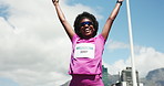 Celebrate, running and black woman in city for marathon achievement, finish and workout goals. Happy, excited and person in town with arms raised for exercise milestone, training and success for race