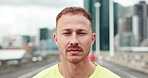 Face, runner and man in city, fitness and cardio challenge with wellness, urban town and serious. Workout, athlete or healthy person in street, exercise or pride with practice for marathon or warm up