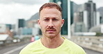 Face, man and serious for wellness, city and confident for workout, fitness and commitment for sport. Outdoor, athlete and person with pride for health goals, break and exercise in morning or Canada