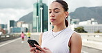 Fitness, smartphone and woman in city, internet and digital app to track progress. Outdoor, athlete and healthy person with cellphone, exercise and message to contact, social media and connection