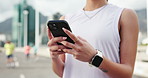 Fitness, smartphone and woman in city, hands and digital app to track progress, texting and exercise. Wellness, athlete or healthy person with cellphone, workout or message to contact or social media