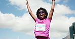 Running, winning and black woman celebrate outdoor for marathon, finish race and workout goals. Happy, excited and person in city with ribbon for exercise milestone, training success and competition