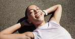 Rest, exercise and above of woman on road for recovery after workout, running and training outdoor. Happy, sports and person relax, breathe and laying on street for wellness, health and fitness break