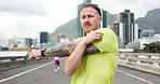 Stretching arms, runner and man in city for exercise, marathon training and workout outdoor. Sports, health and person with warm up routine for running, endurance challenge and fitness for wellness