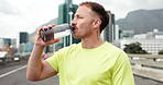 Drinking water, outdoor and man with fitness, health and rest with training, nutrition and challenge. Wellness, runner and person with liquid, hydration and thirsty with break, fatigue and workout