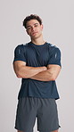 Personal trainer, face and man with arms crossed in studio, fitness support or training pride for health. Serious, confident or sports coach on white background, body transformation or exercise goals