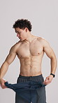 Body, face and remove shirt with man in studio for strength training or workout results. Exercise, fitness and muscles with shirtless bodybuilder on white background for health, vitality or wellness