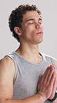 Breathing, meditation and yoga with man in studio for awareness, inner peace of wellness. Balance, fitness and exercise with holistic person on white background for calm, mindfulness or zen routine