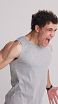 Fitness, man or scream in studio for motivation, training or workout on white background. Athlete, person and shout for power, emotional release or intense challenge with energy for preparation hype