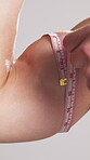 Bodybuilder, man or arm in studio with tape measure, exercise results or training progress. Strong, person or check size of bicep for bodybuilding, muscle growth or fitness goals on white background.
