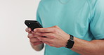Hands, fitness and man in studio, cellphone and connection on white background. Exercise, chatting or person with smartphone, internet and digital app to track progress, typing and message to contact
