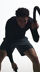 Man, battle rope and training in studio with power, cardio and exercise for muscle on white background. Person, workout and intense routine with gym equipment, gear and challenge for endurance