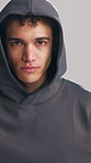 Face, fitness and hoodie with man in studio for dedication to training or workout development. Commitment, exercise and serious with athlete in sweater on white background for sports challenge