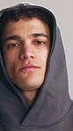 Exercise, face and hoodie with man in studio for dedication to training or workout development. Commitment, fitness and serious with athlete in sweater on white background for sports challenge