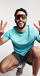 Man, fitness and sunglasses in studio with peace sign, happy and fist pump for exercise on white background. Person, smile and shades with emoji, symbol and excited with hand gesture for training