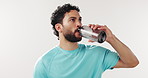 Exercise, drinking and man in studio with water for hydration, wellness and health on space. White background, mockup and person with bottle, liquid and minerals for fitness, recovery and break