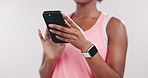 Hands, fitness and woman in studio, smartphone and connection on white background. Exercise, online chatting and person with cellphone, typing and digital app to track progress and message to contact
