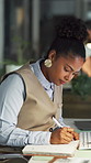 Notebook, planning and research with business black woman in office at night for report or review. Notes, pen and writing with African employee at desk in dark workplace for agenda or information