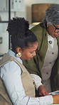 Women, document and discussion in office for planning, feedback or project management. Mature manager, intern or paperwork with graphs for job requirements, daily tasks or agenda for small business