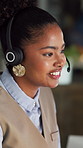 Happy woman, consultant or night with headset in office for online communication or advice. Female person, agent or working late with mic for virtual assistance, help or customer service in workplace