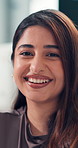 Face, about us and Indian woman in office with smile, pride and confidence in workplace. Happiness, portrait and female person in agency with excitement, professional and job goals in career growth.