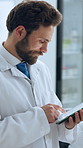 Scientist, man and tablet with reading for problem solving, feedback and medical research. Biotech, laboratory and tech with digital app for pharmaceutical analysis, pathology or experiment results