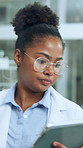 Science, tablet and woman writing on board in lab for formula, problem solving and physics. Technology, solution and scientist with glass for planning, equation and symbol for medical research
